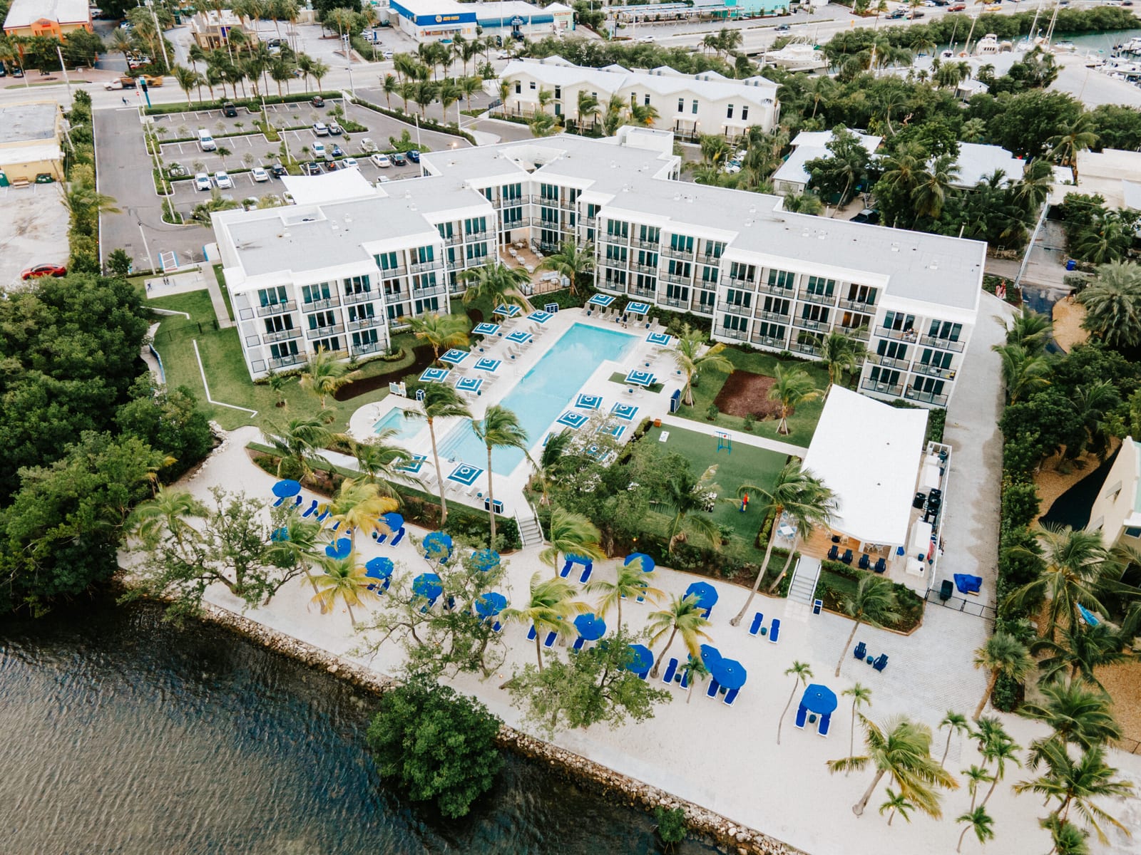 Aerial view of Capitana Key West, its pool deck and the waterfront