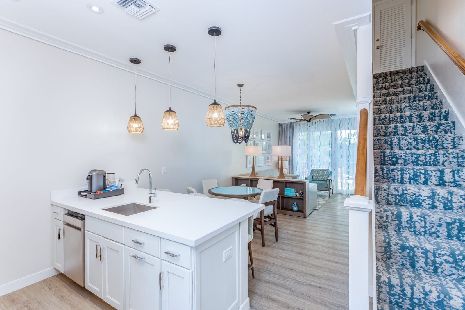 Guest suite kitchen at Capitana Key West with pendant lighting over the island
