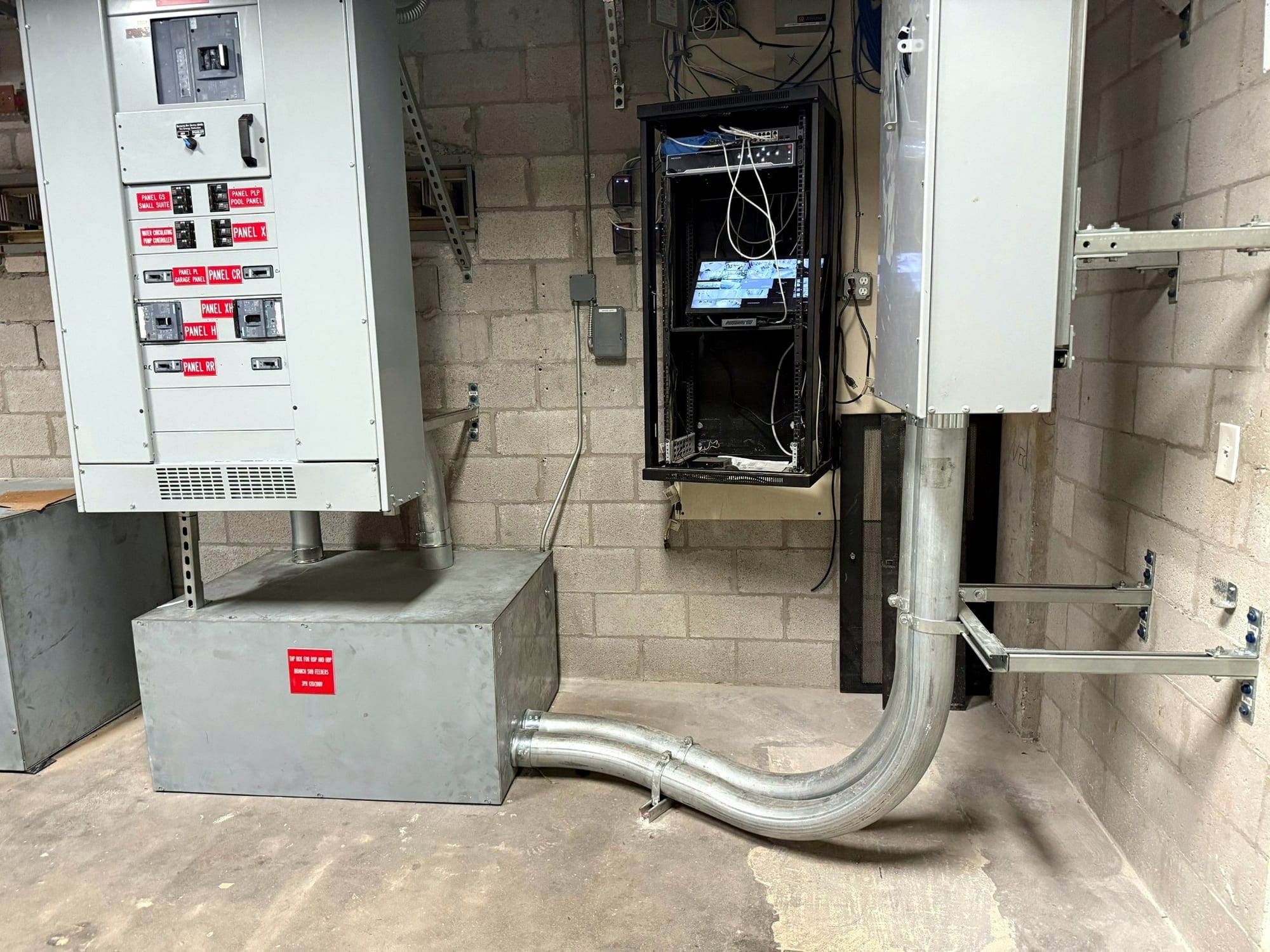 Distribution switchboard and large feeder raceway inside the electrical room